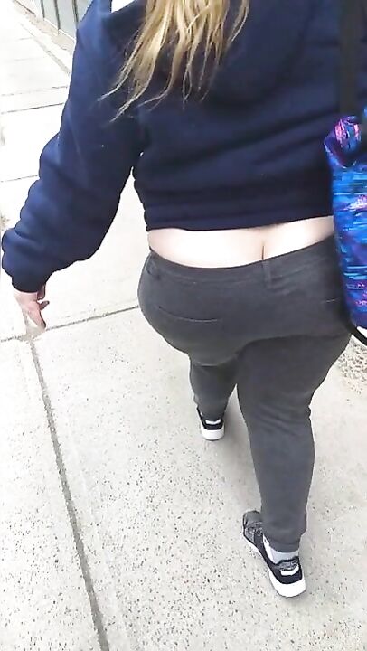 Booty hanging out of jeans lol. I know she could feel the breeze